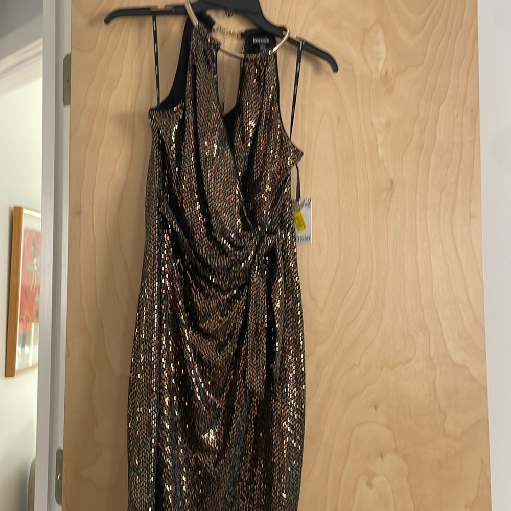 Beautiful, tags still attached, never worn Kenzie dressy dress, size 2.